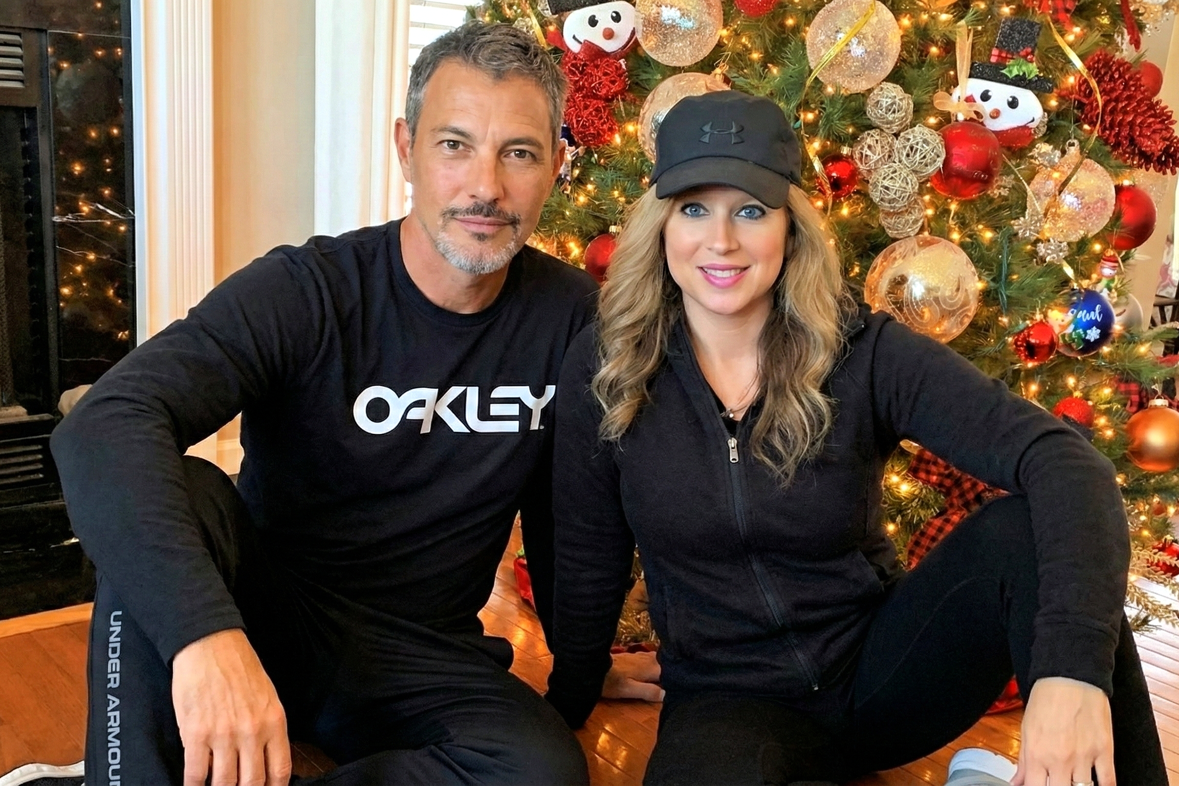 Heather Killebrew smiling in a black cap next to Joey Montes during Christmas in Wildwood.