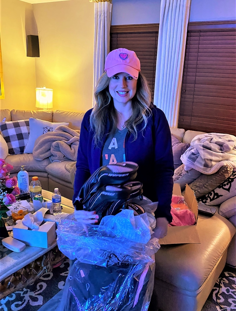 Heather Killebrew with the Golf clubs I got for her 46th Birthday. Lady King Cobras.