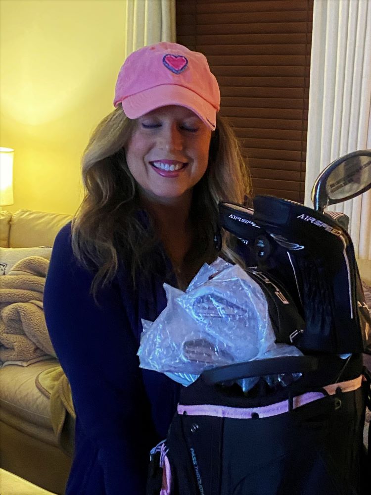 Heather Killebrew with the Golf clubs I got for her 46th Birthday. Lady Cobras. We took lots of photos.