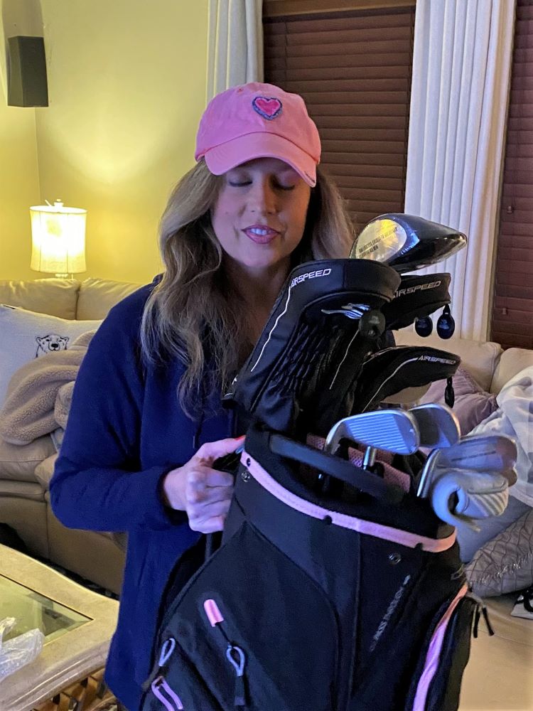 Heather Killebrew with the Golf clubs I got for her 46th Birthday. Lady Cobras. We took lots of photos.