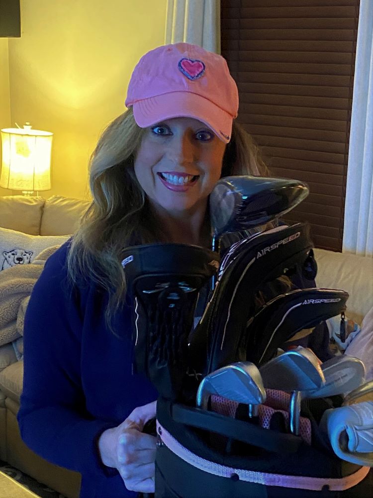 Heather Killebrew with the Golf clubs I got for her 46th Birthday. Lady Cobras. We took lots of photos.