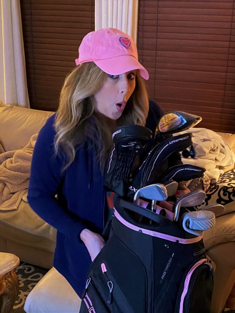 Heather Killebrew with the Golf clubs I got for her 46th Birthday. Lady Cobras. We took lots of photos.