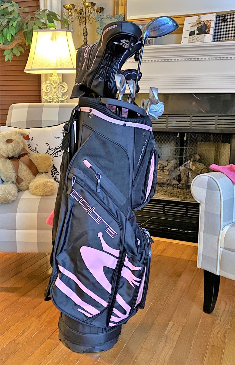 Heather Killebrew with the Golf clubs I got for her 46th Birthday. Lady Cobras. We took lots of photos.
