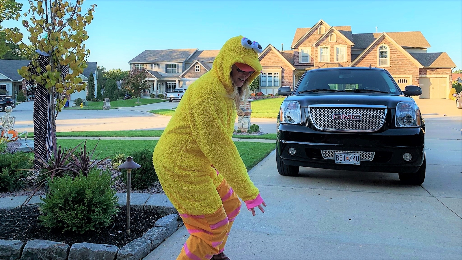 Heather Killebrew off the hood of the car, not sure what's she is doing, but she is doing something.