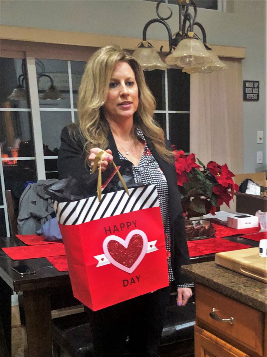 Heather Killebrew giving AJM a Gift bag for his 10th Birthday.