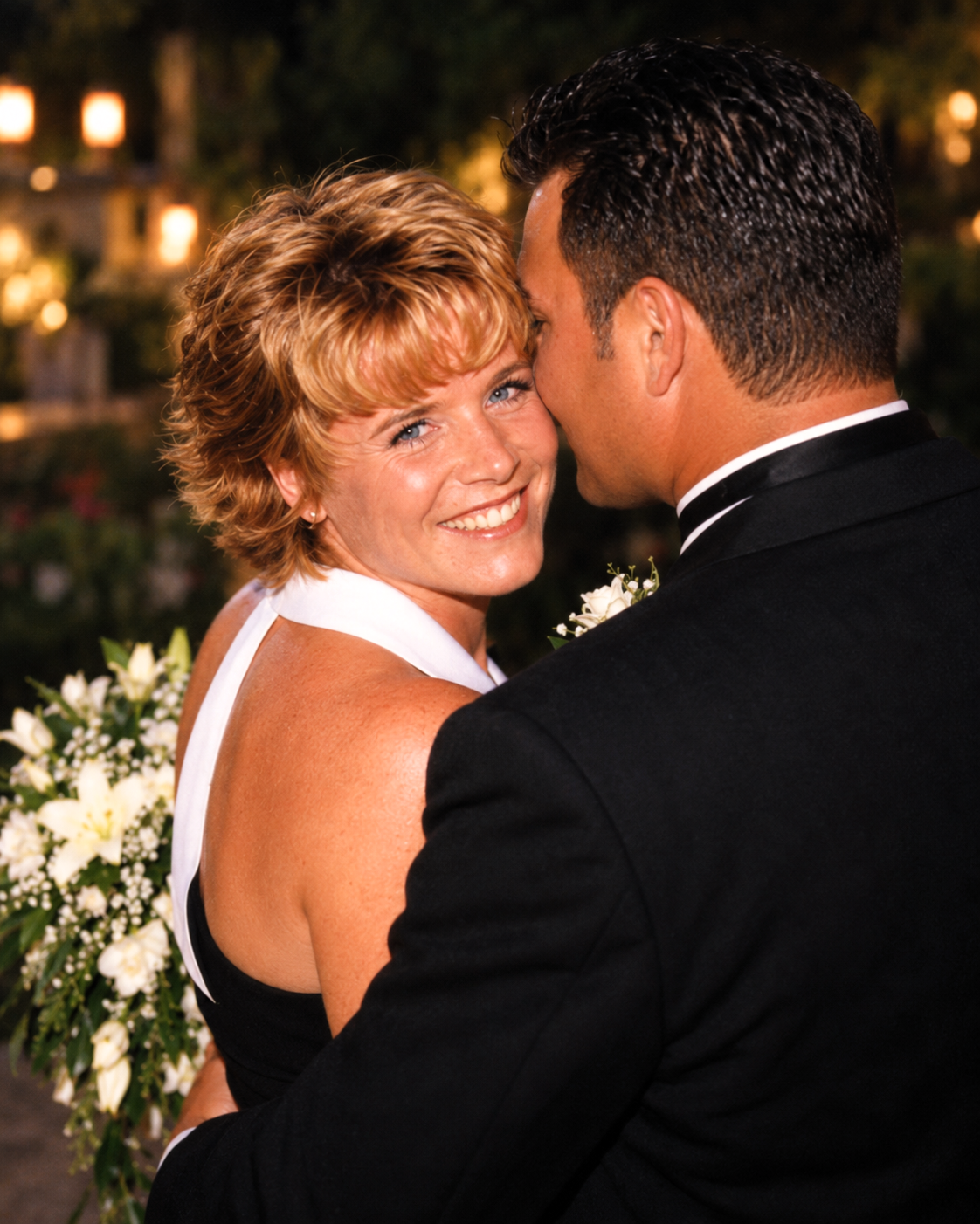 Dawne looking toward the camera and smiling while Joey turns toward her, July 27, 2001.