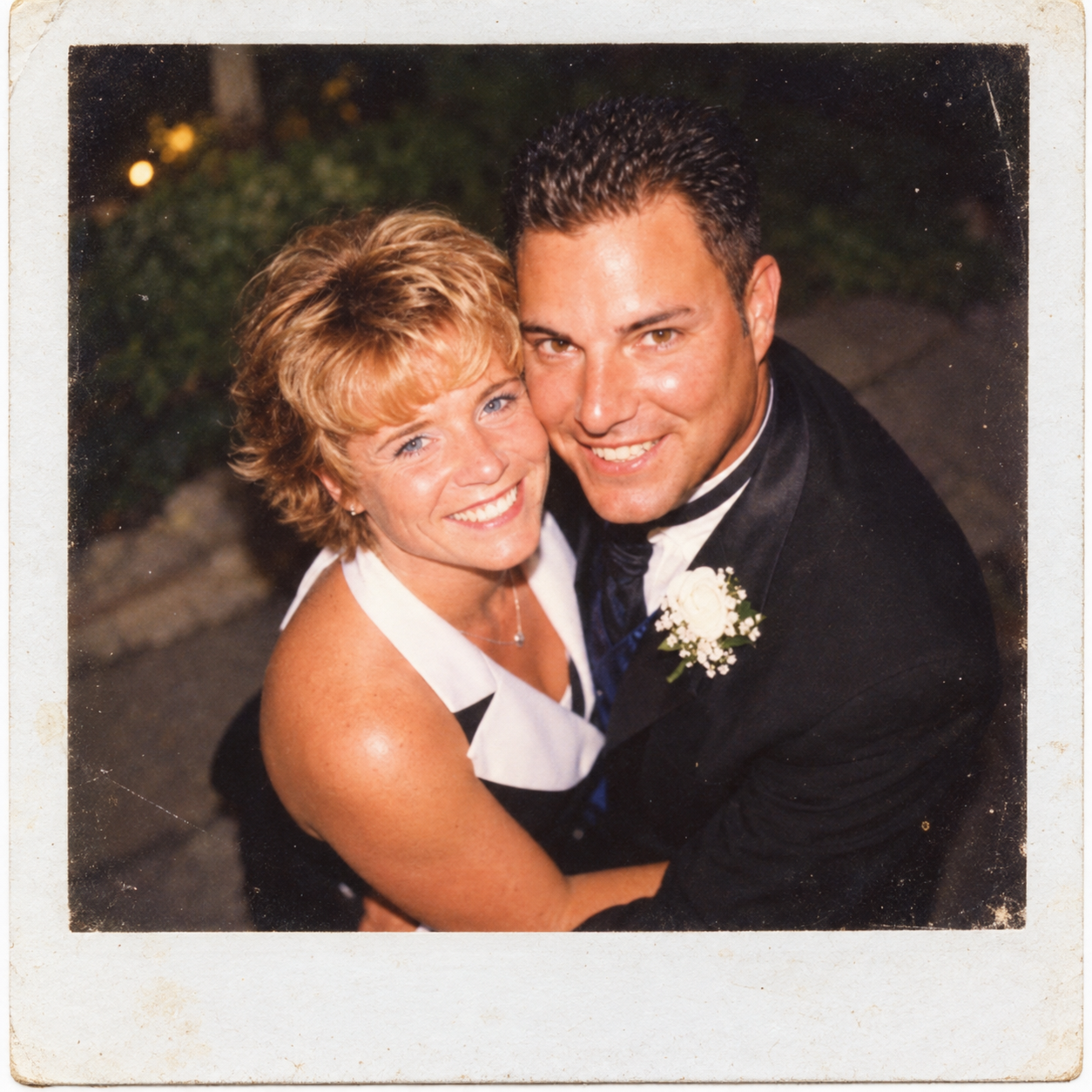 Dawne and Joey embracing and smiling together during an evening celebration on July 27, 2001.