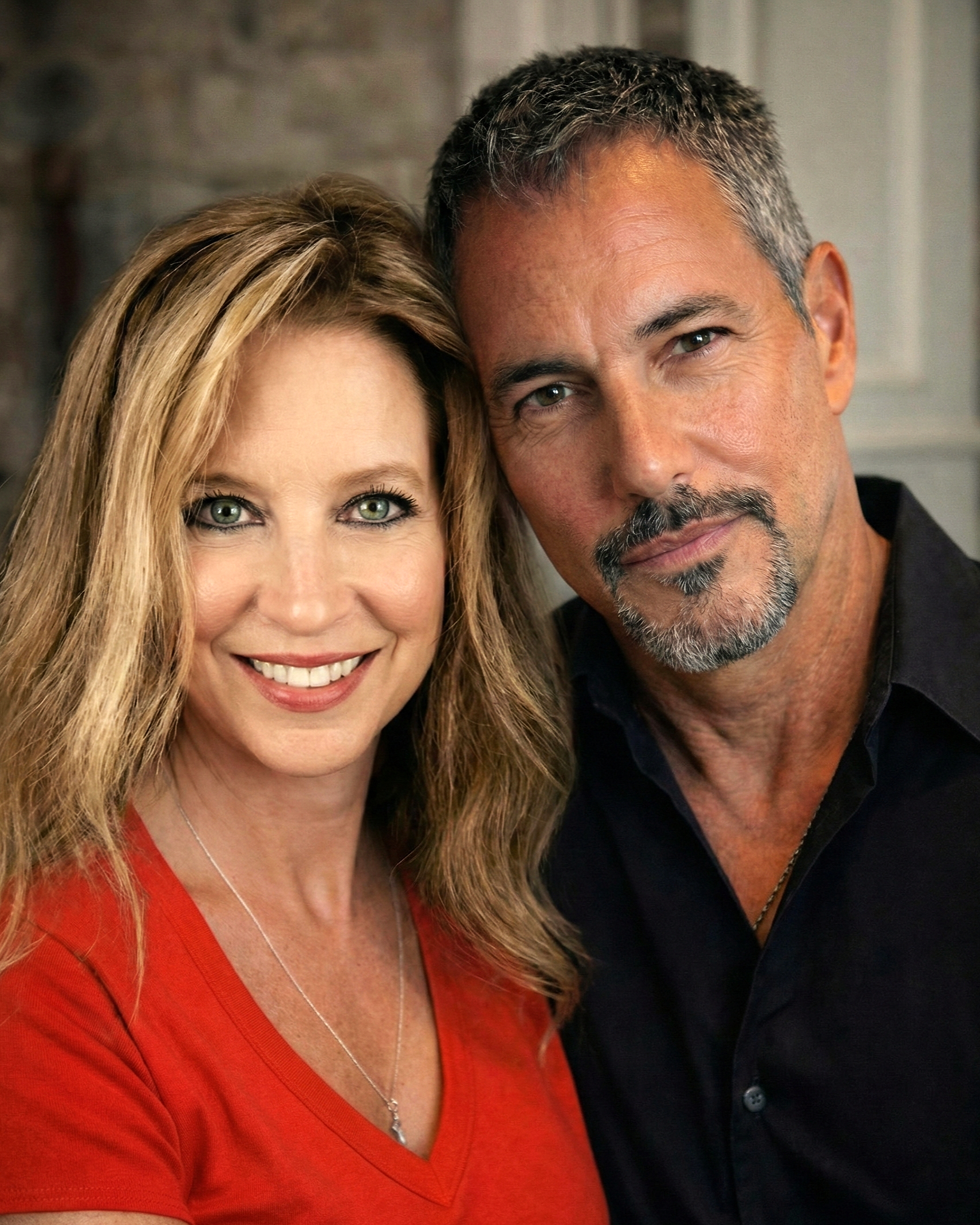 Close-up portrait of Joey Montes and Heather smiling together in Wildwood, 2023.