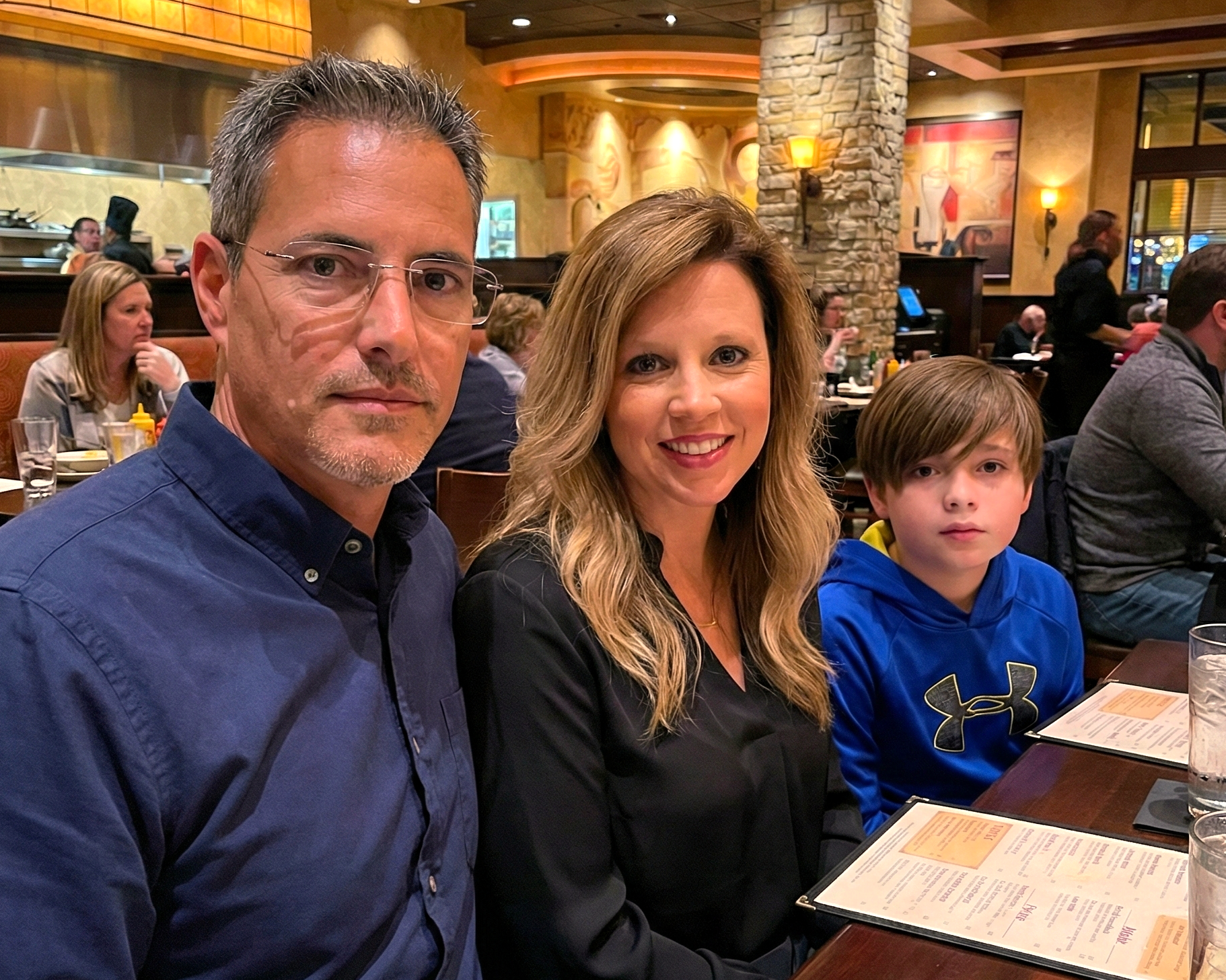 Casual family dinner at The Cheesecake Factory with Joey Montes, Heather Killebrew, and a young boy in a blue hoodie.