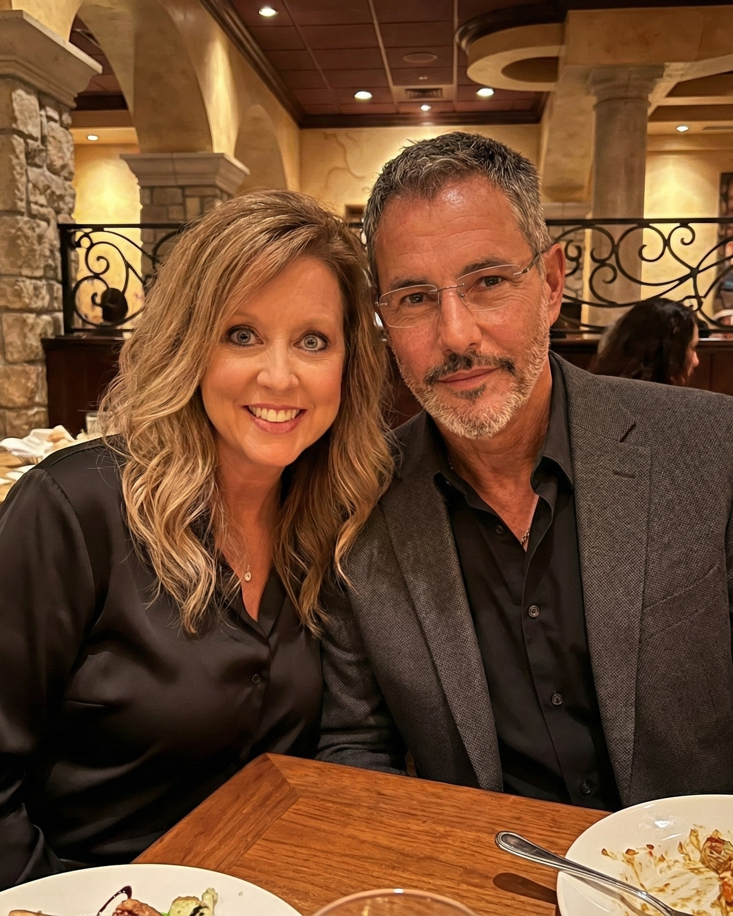 Close-up portrait of Heather Killebrew and Joey Montes leaning heads together at The Cheesecake Factory in Chesterfield, MO.