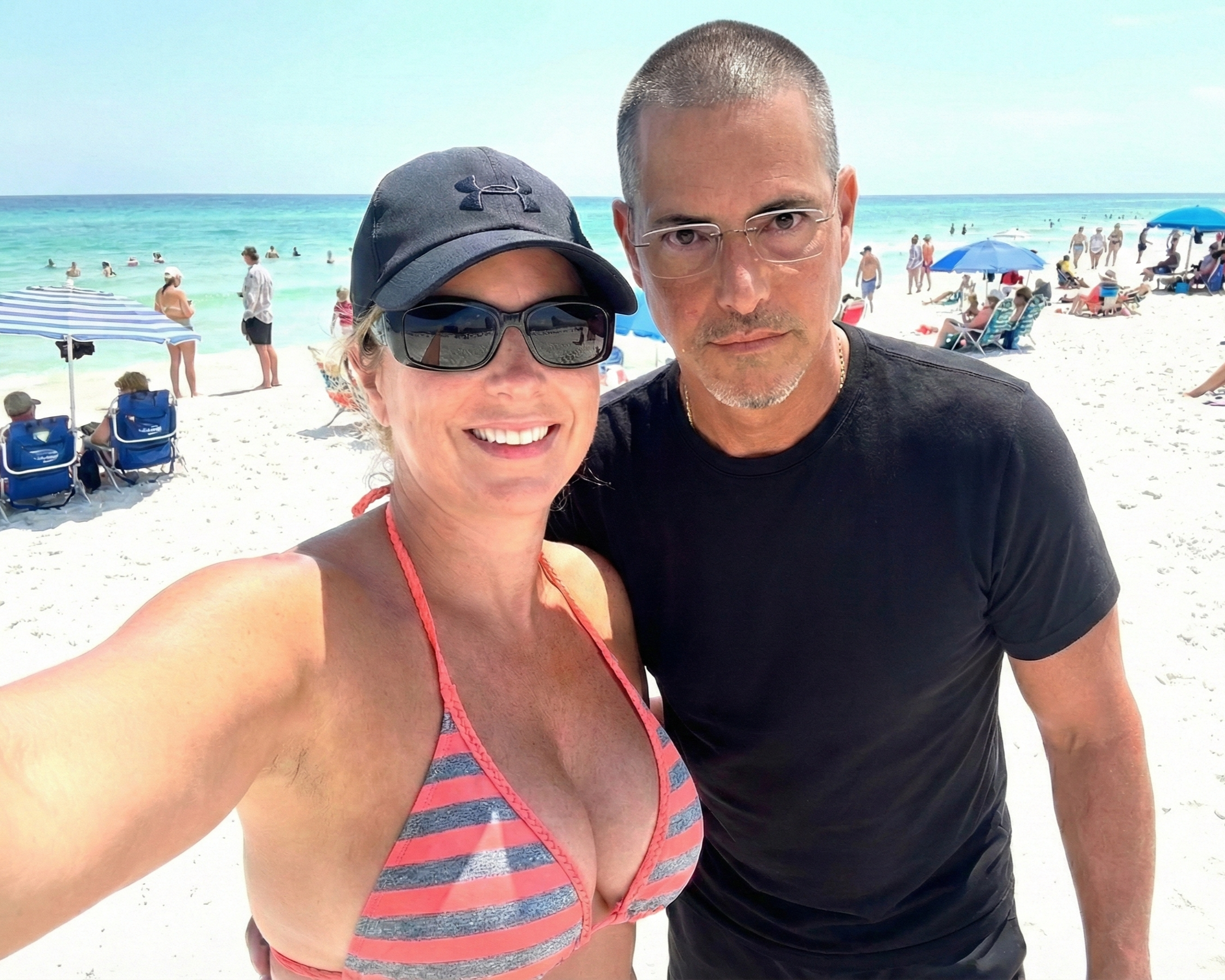 Selfie of Heather Killebrew and Joey Montes on the white sandy beach of Destin, Florida, in 2020.