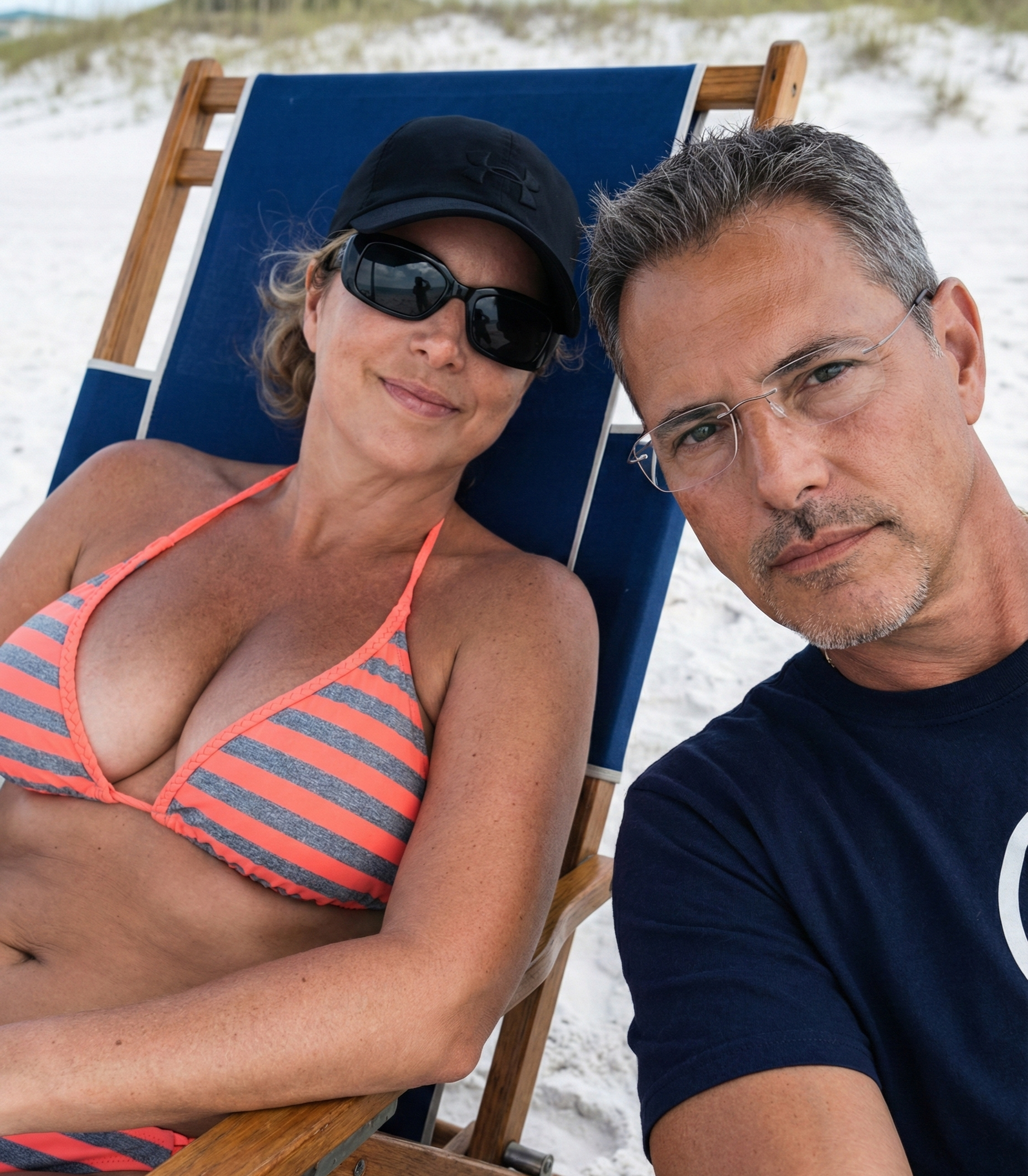 Selfie of Joey Montes and Heather Killebrew relaxing in a beach chair on the white sand in Destin, Florida, 2018.