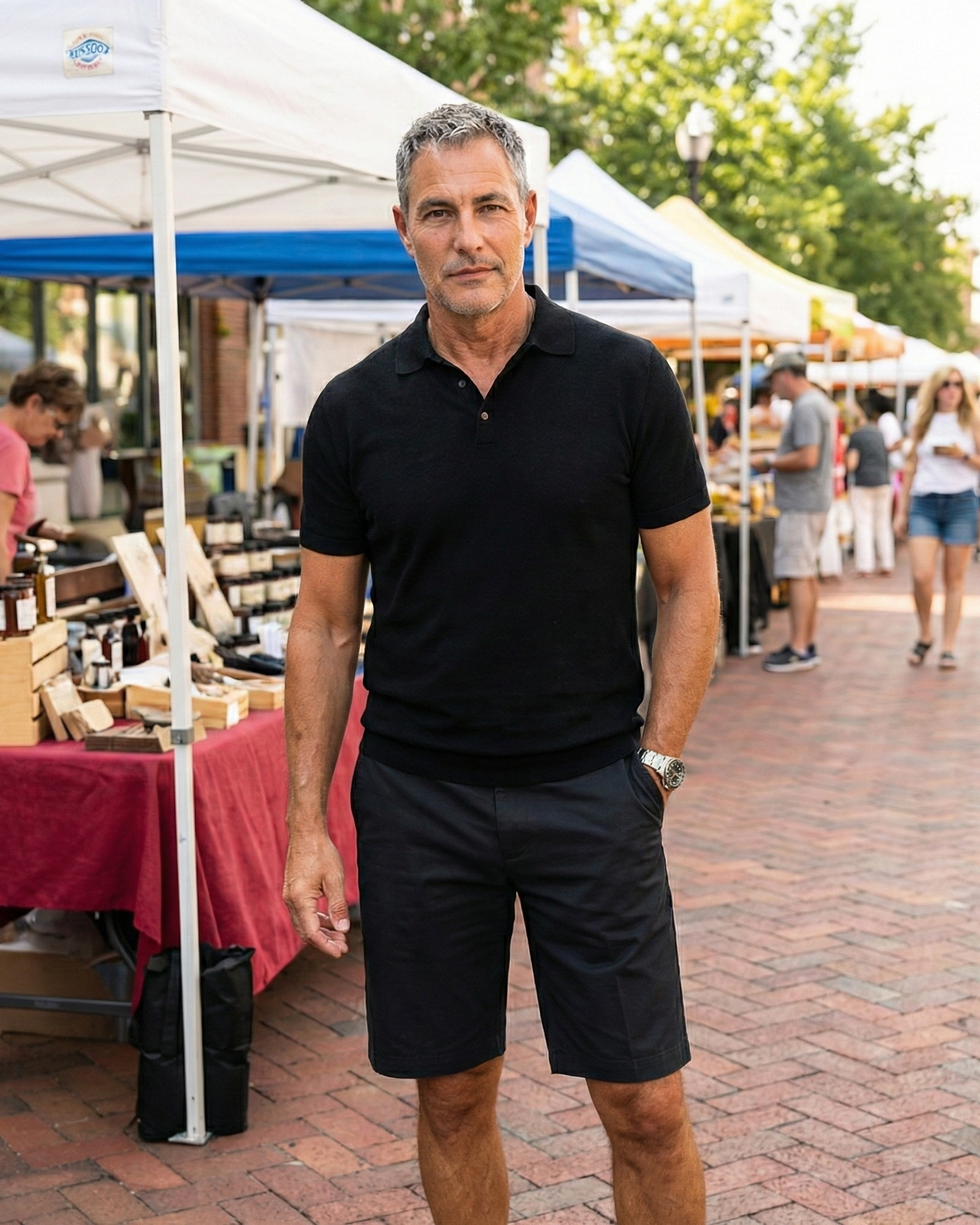 Portrait of Joey Montes in a black polo at a farmer's market in Wildwood, MO.