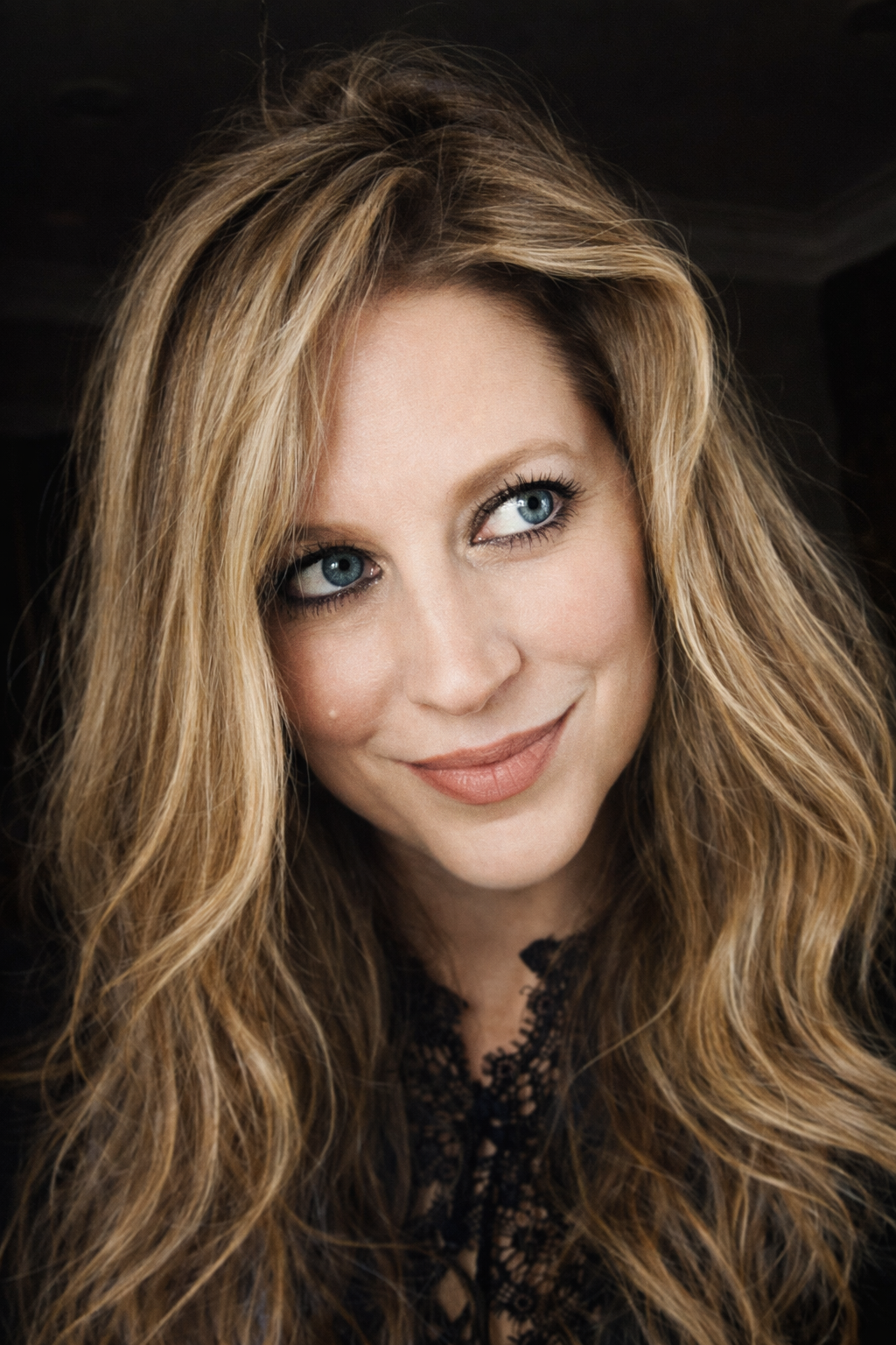 Candid-style selfie of Heather Killebrew looking to the side with a smile during Thanksgiving in Dresden, TN.