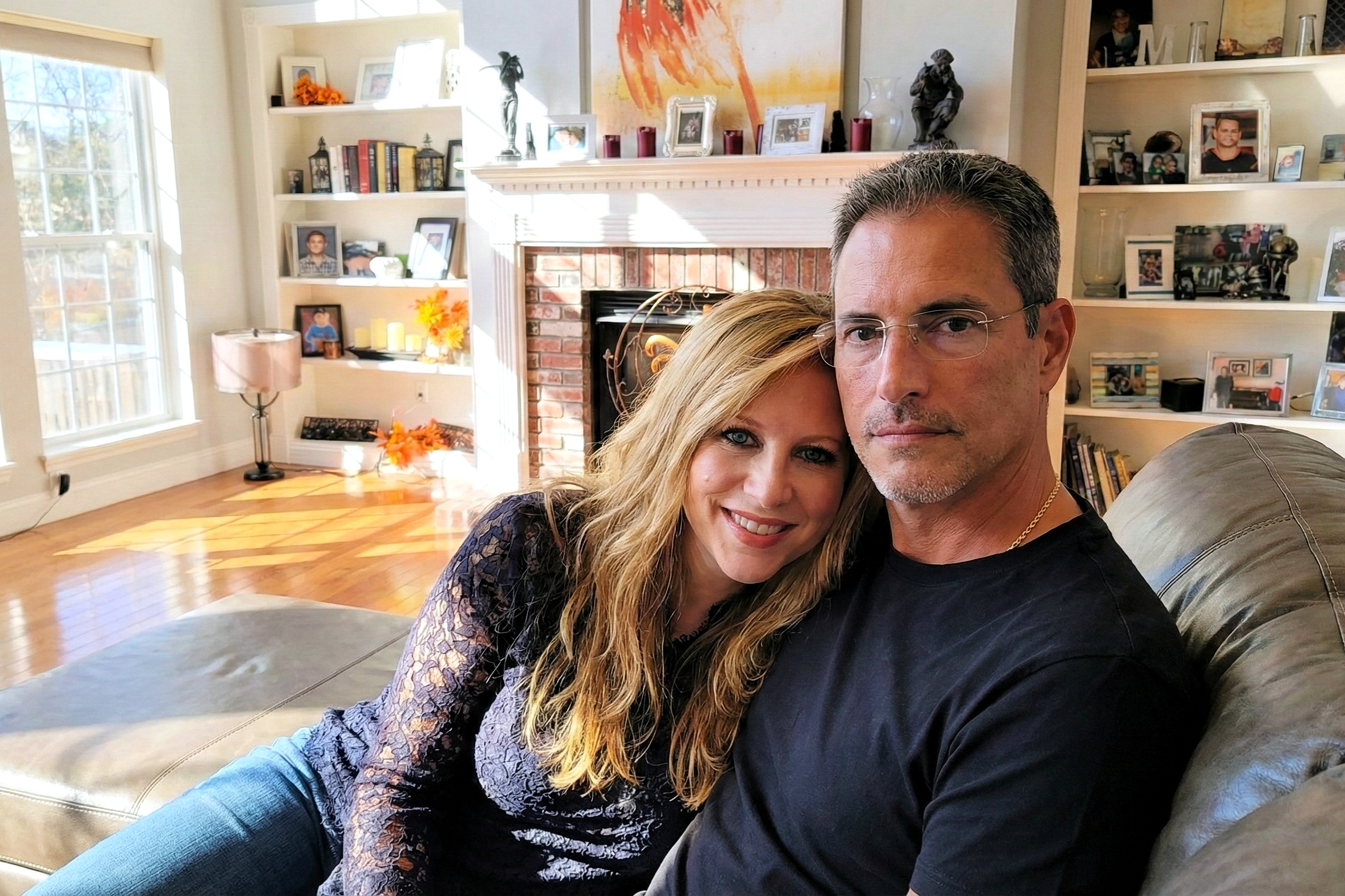 Sunlit portrait of Heather Killebrew leaning on Joey Montes' shoulder in their Wentzville living room.