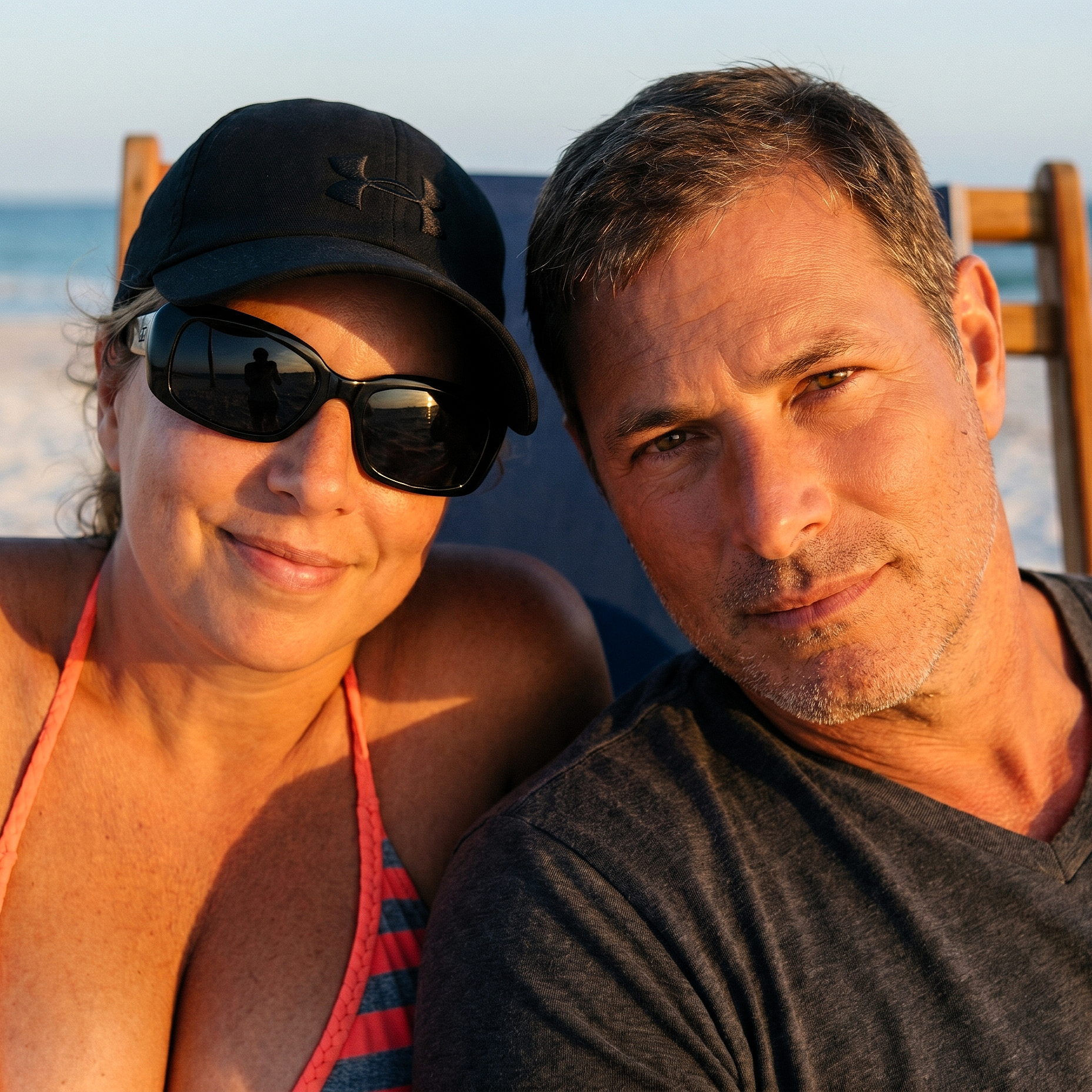 Heather and her companion leaning in for a sun-drenched beach portrait in Destin, June 2018.
