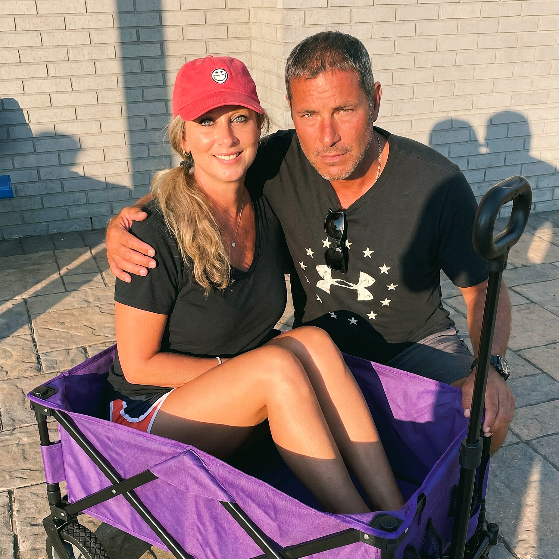 Heather sitting in a purple wagon with her companion in Destin, Florida, Summer 2019.