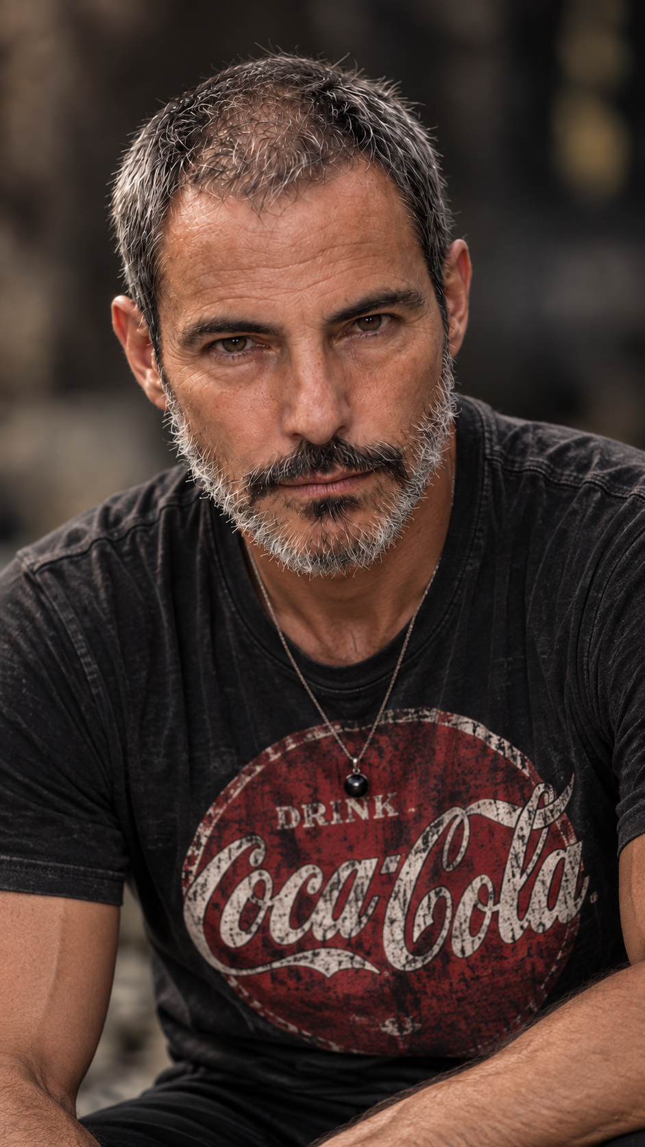 Portrait in a vintage Coca-Cola shirt reflecting continued recovery and adaptation after a stroke.