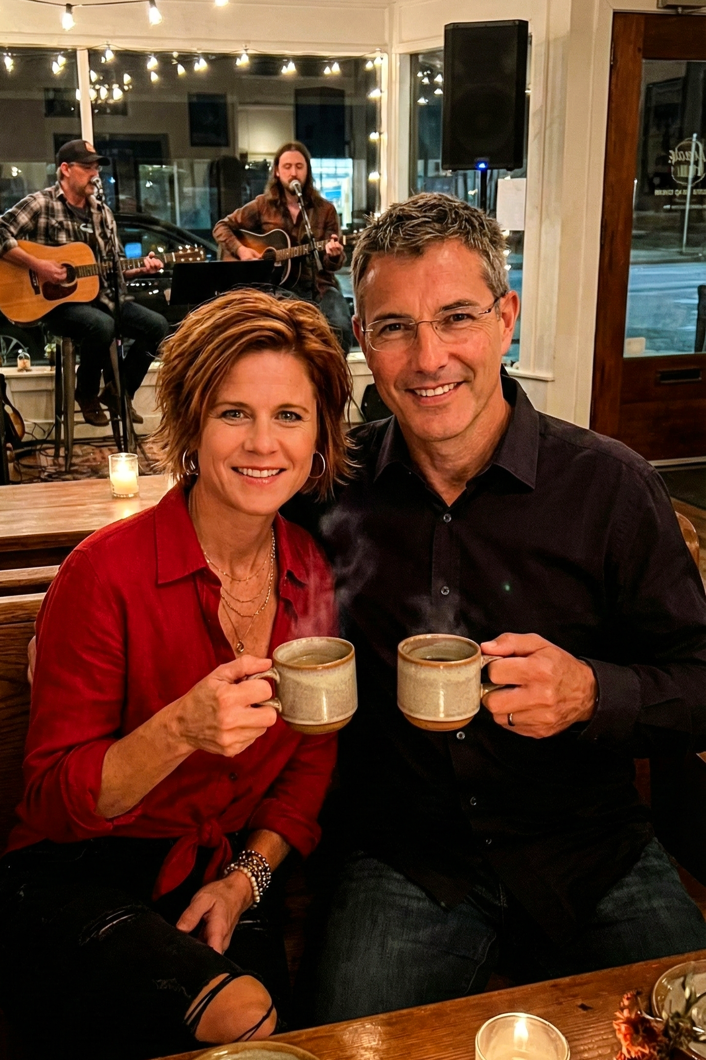 A warm portrait of Joey Montes and Dawne enjoying hot drinks and live music.